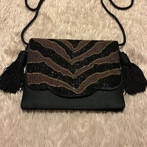 Neiman Marcus black and gold beaded crossbody evening bag with tassels